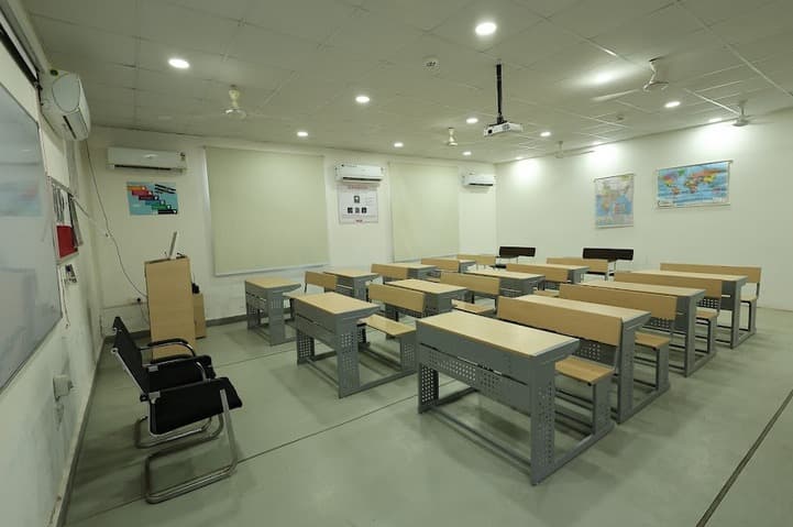 Pilot in helicopter cockpit with headset and controls